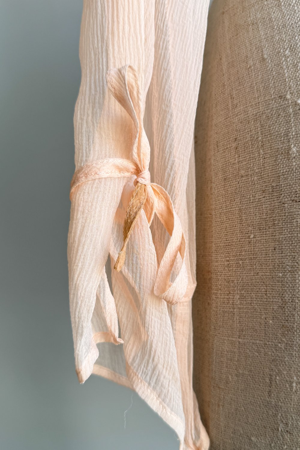 EMERIEU-Lolita-Lempicka-1990s-vintage-blush-pink-draped-tie-crop-long-sleeve-blouse-flaw2